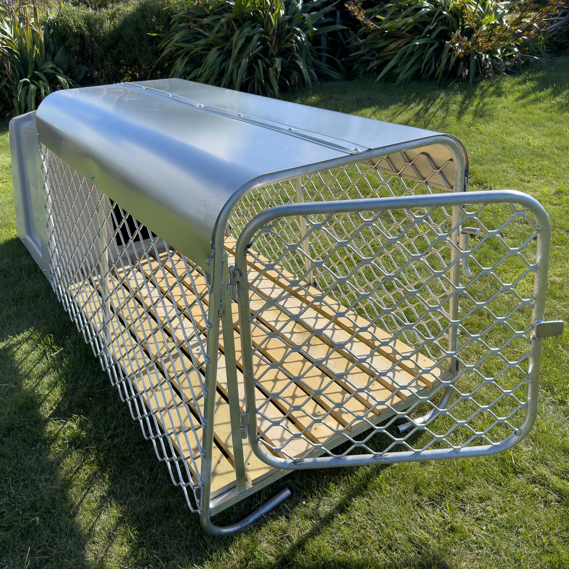 Aurora alloy outdoor dog run with gate open showing timber flooring and attached to thermokennel durable outdoor kennel setup