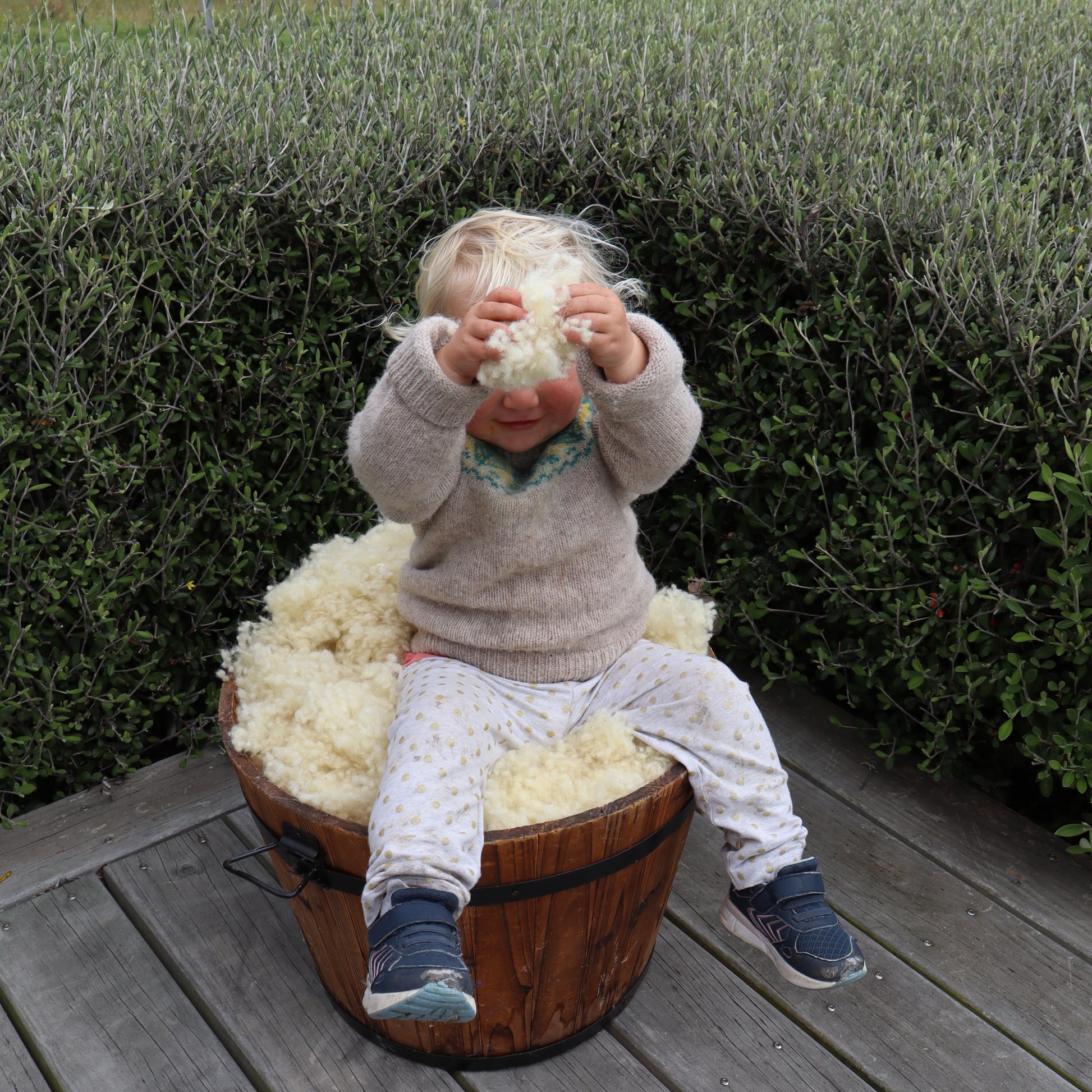 LB showing the NZ wool knots used in the filling of all the Tussock Dog Beds as insulation 