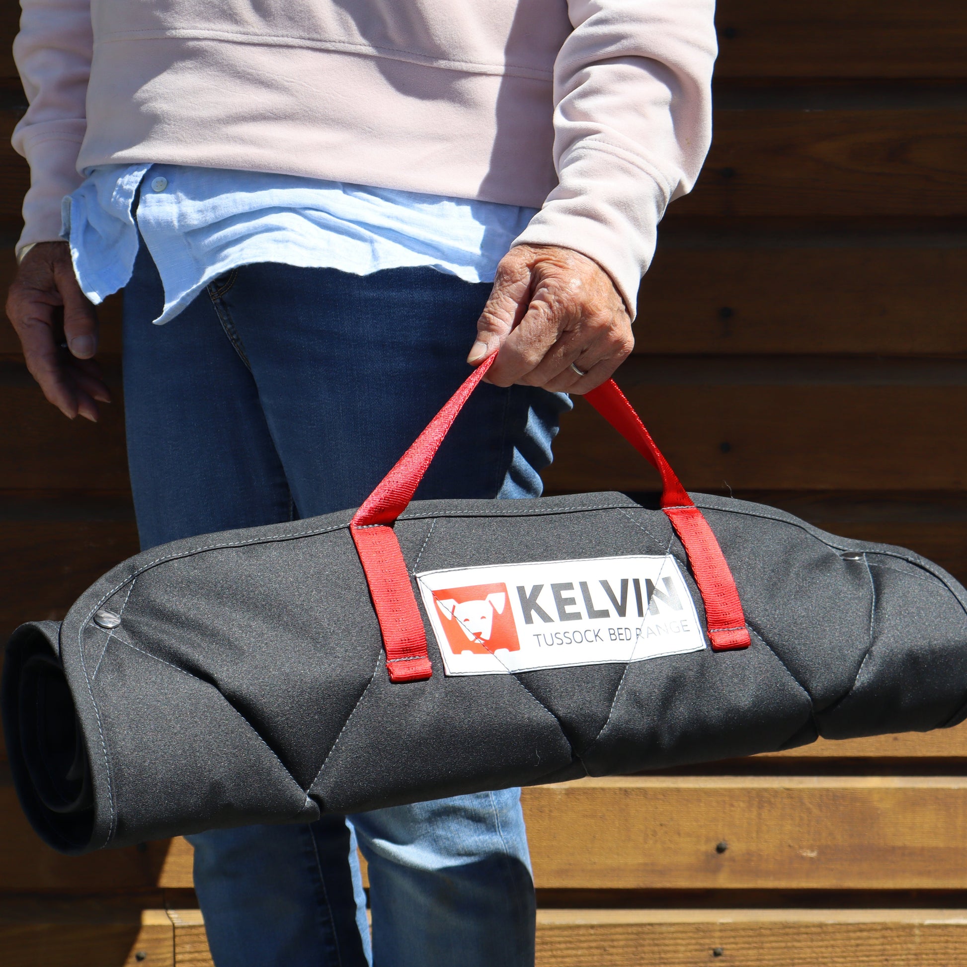 Carry the tussock dog mat on the go, premium NZ wool filled mat with carry handle