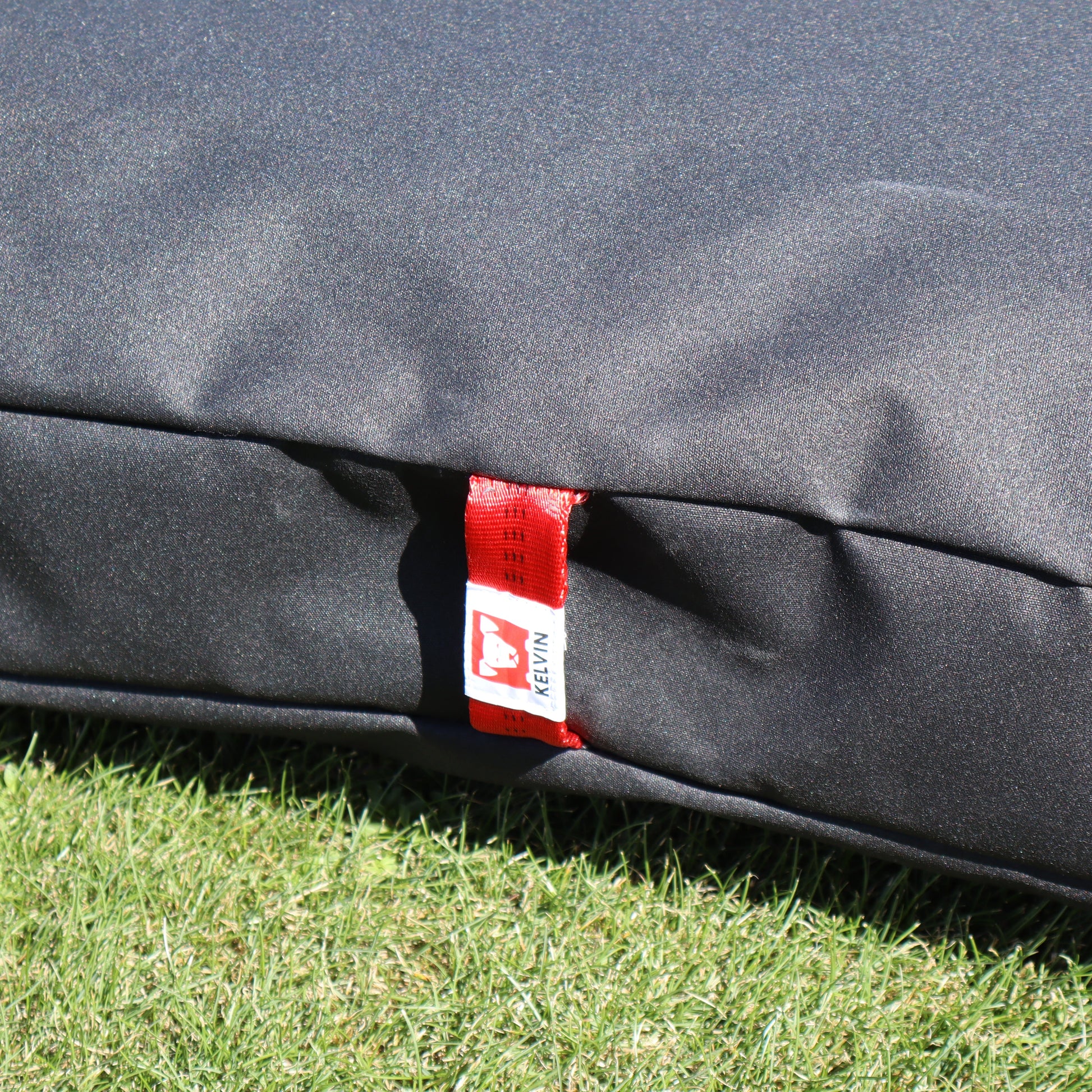 Durable reinforced carry handles on Tussock large outdoor dog bed