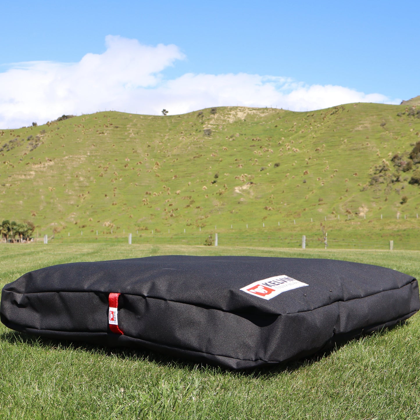 Tussock Large dog bed showing thickness of wool knot insulation in durable canvas outer with reinforced handle