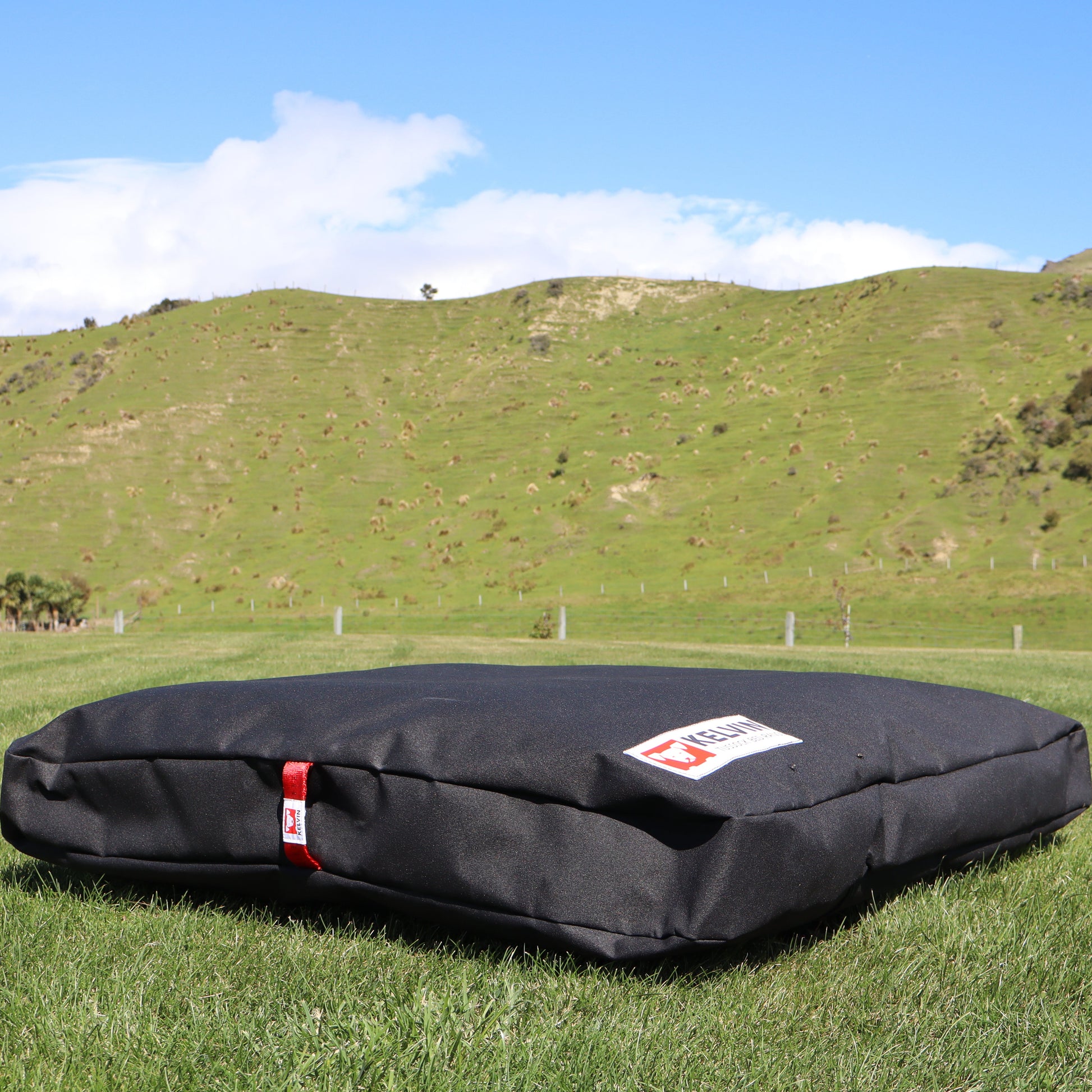 Tussock Large dog bed showing thickness of wool knot insulation in durable canvas outer with reinforced handle